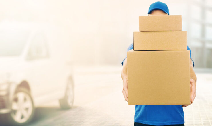delivery man holding pile of cardboard boxes in front. copy spac delivery man holding pile of cardboard boxes in front. copy space